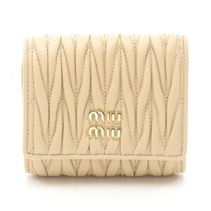 Miu Miu Matelasse tri fold wallet leather beige